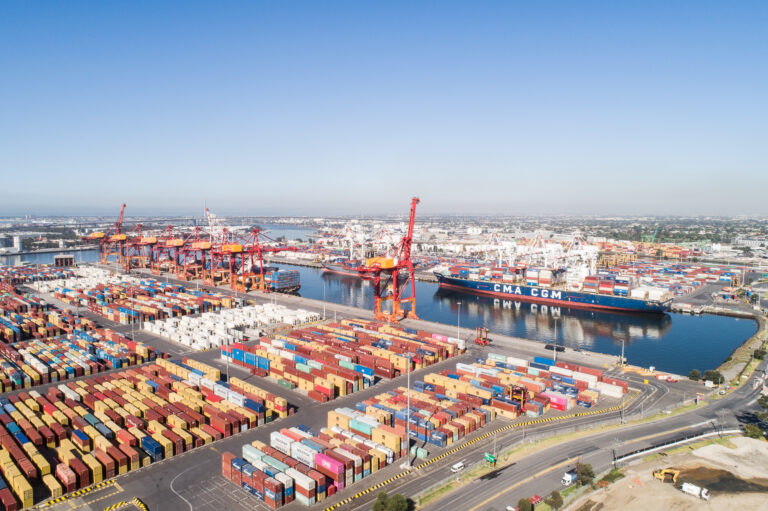 Drone aerial photography of Coode Island shipping yard Melbourne showing container stacks, cranes and port logistics infrastructure