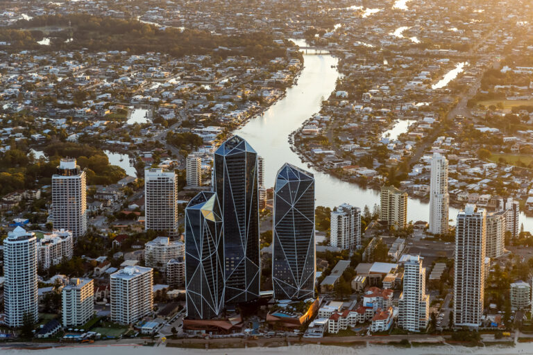 Aerial photography of the Jewel towers on the Gold Coast showing luxury beachfront high rise apartments and surrounding coastline captured during golden hour for real estate marketing