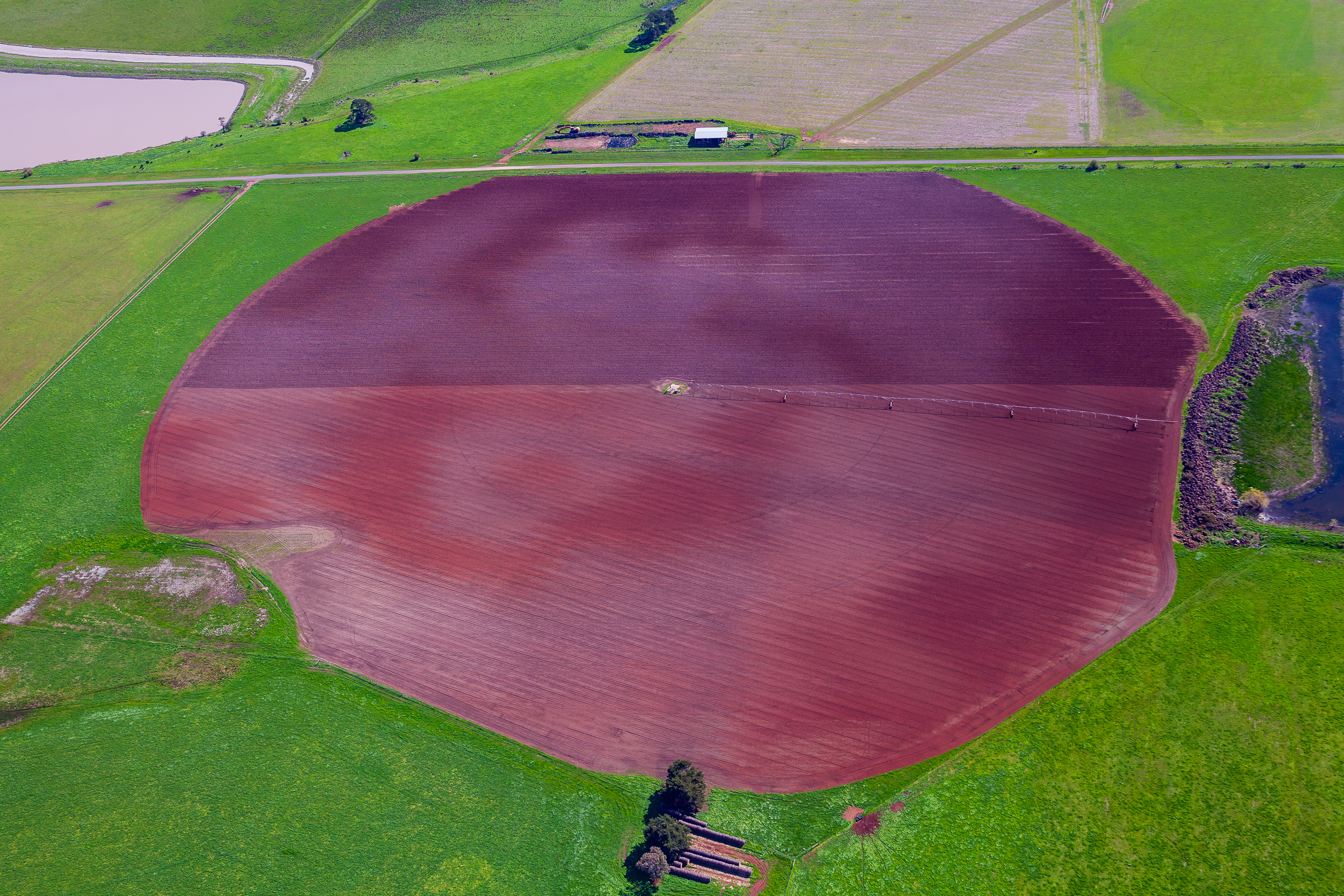 Aerial image of Victorian farm boundary with creek line, native vegetation corridor and productive cropping land