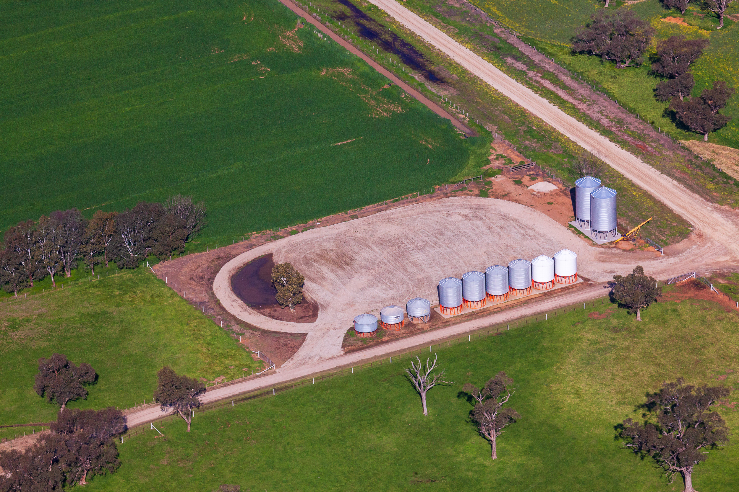 Farm aerial photograph capturing dams, tree plantations and paddock infrastructure across Victorian agricultural property
