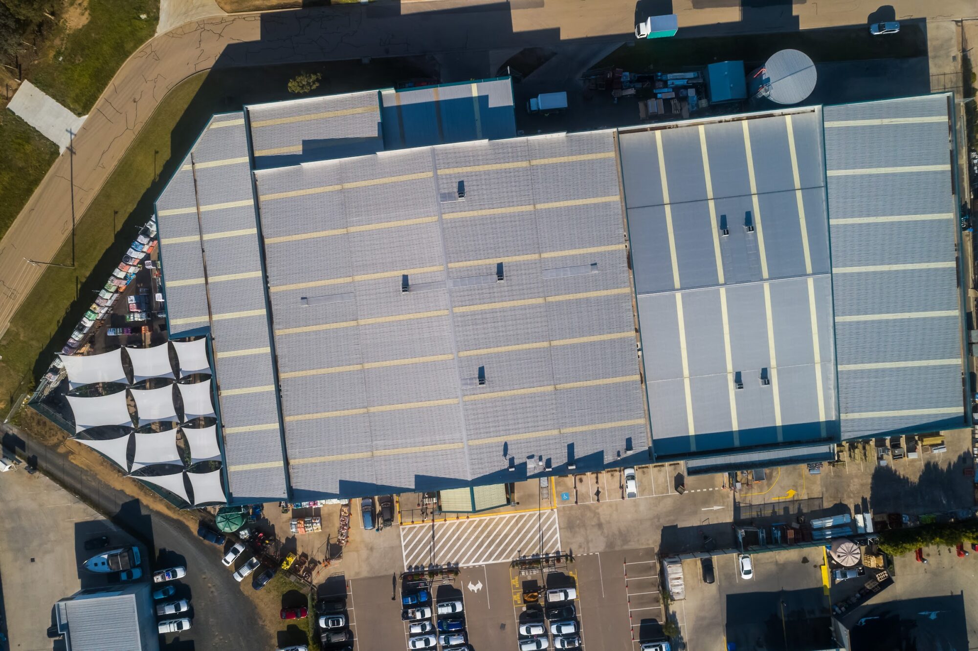 Top down aerial photograph of Bairnsdale Warehouse solar panelled roof in country Victoria