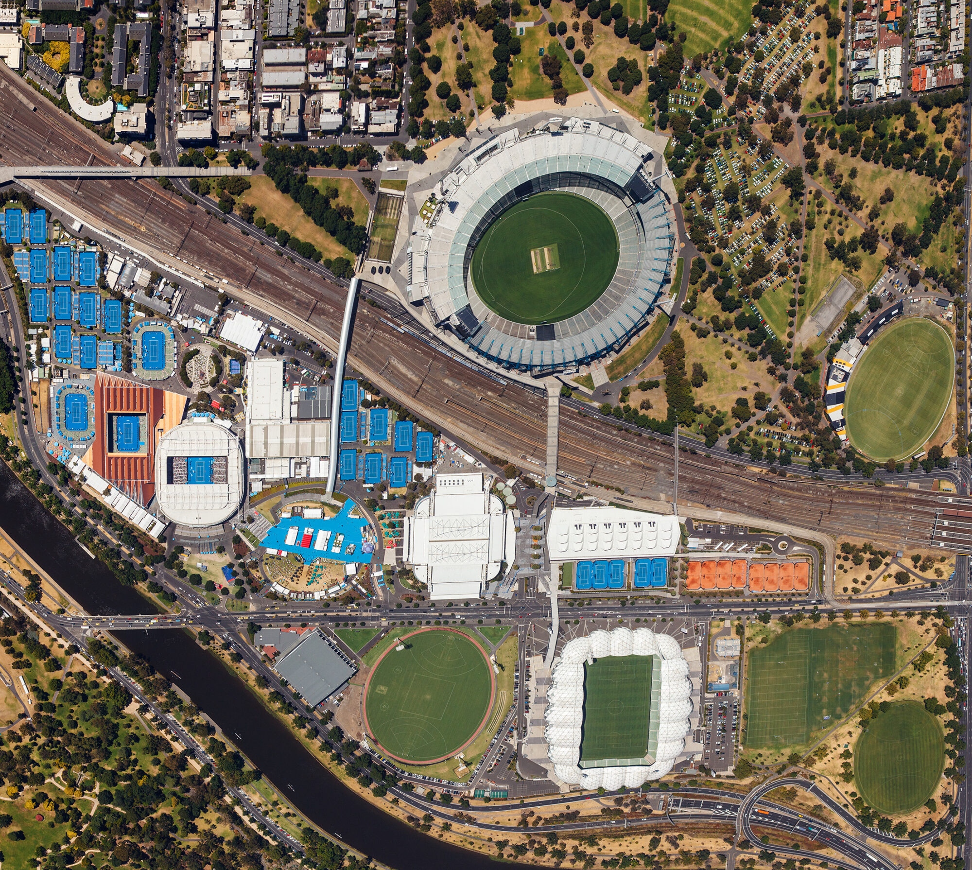 Vertical aerial photograph of Melbourne and Olympic Parks precinct in 2014 showing Rod Laver Arena, tennis courts and surrounding venues